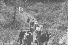 UCSC-00-003_1967_3_X_group-walk-to-select-site-for-first-garden-at-UCSC-campus_Alan-Chadwick-walking-with-woman-in-rear__photo-by-Eric-Thiermann_used-by-permission